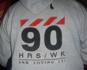 photo: Apple sweathshirt, words: '90 hrs/wk and loving it'